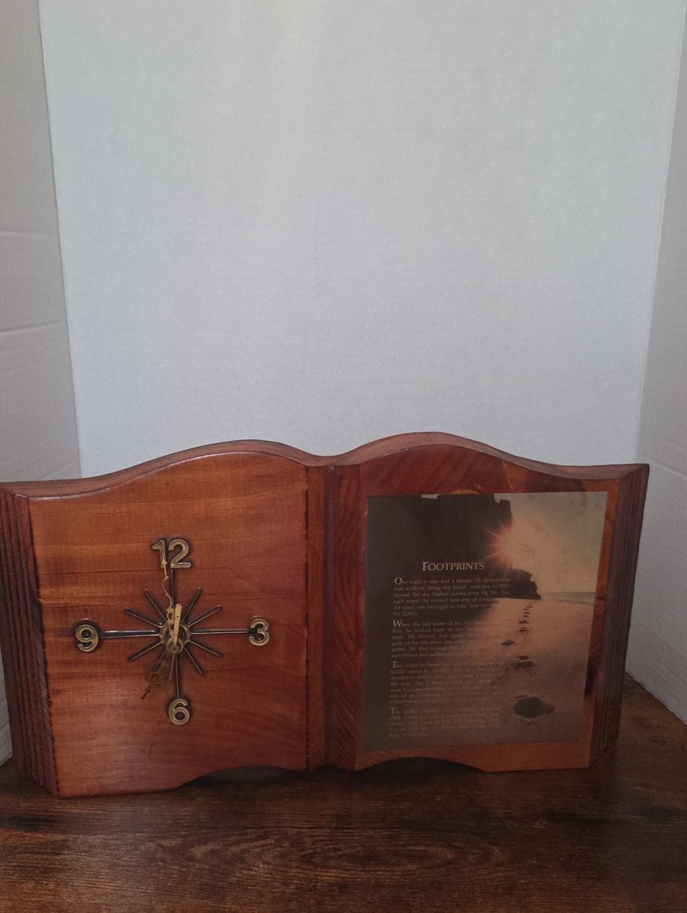 vintage 1980s wooden clock shaped like an open book, featuring "Footprints"